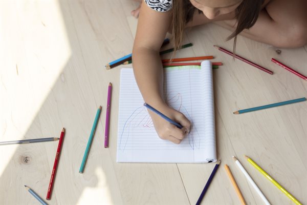 Young person making artwork 